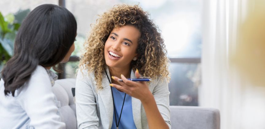 A female doctor talking to a patient